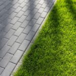 Lawn edge by paving stones