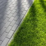 Lawn edge by paving stones